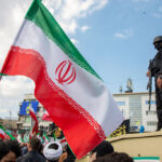 TEHRAN, IRAN - APRIL 1: Members of security forces watch over the crowd during a funeral procession held for IRGC Navy Chief Alireza Tangsiri, alongside other senior naval commanders and their families who were killed in US-Israeli strikes in late March, on April 1, 2026 in Tehran, Iran. The United States and Israel continued their joint attack on Iran that began on February 28. Iran retaliated by firing waves of missiles and drones at Israel, and targeting U.S. allies in the region. (Photo by Majid Saeedi/Getty Images)